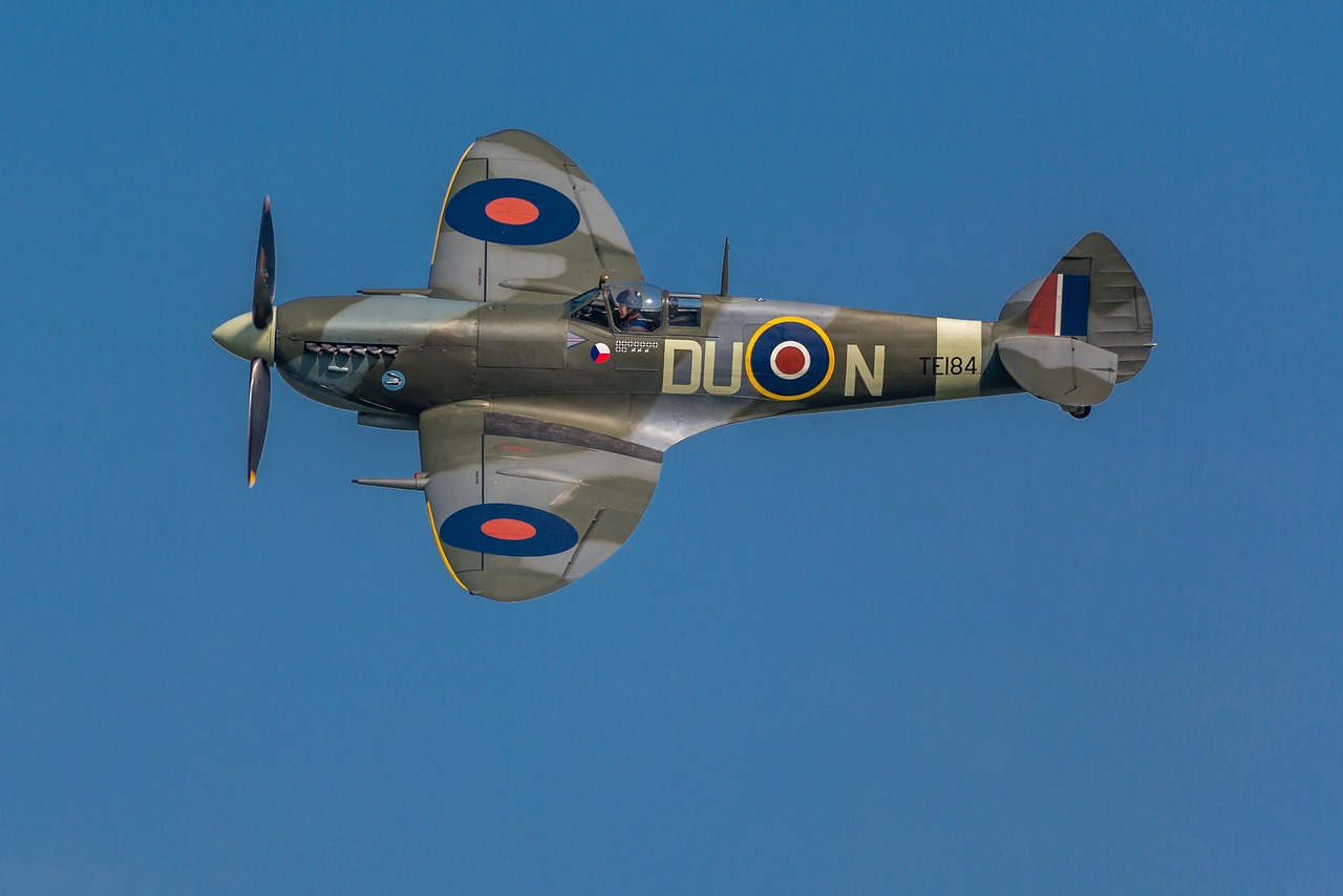 Image of a spitfire aeroplane in flight on a blue background